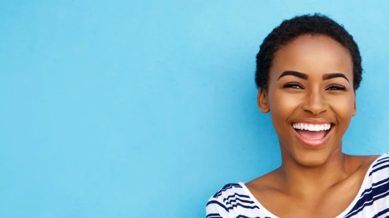 dental patient smiling after crown lengthening procedure