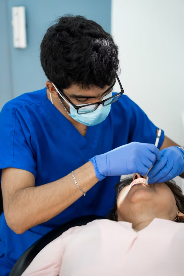 a dental professional treating a patient